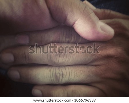 Young Male touch mom hand and holding