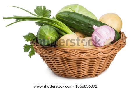 Vegetables in basket isolated on white background.