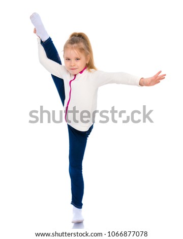  little girl gymnast performs an exercise. Balance on one leg with a grip. Sport concept, gymnastics, fitness. Isolated on white background.
