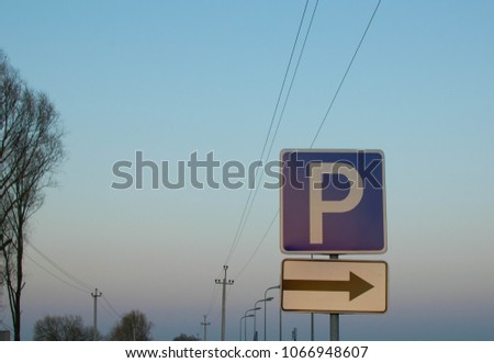 traffic sign parking with right arrow, sunset