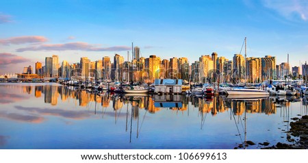 Panoramic view of Vancouver skyline at sunset as seen from Stanley Park, BC, Canada