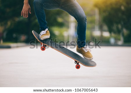 Skateboarder skateboarding  on parking lot Royalty-Free Stock Photo #1067005643