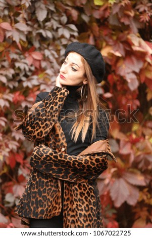 beautiful girl in a leopard coat