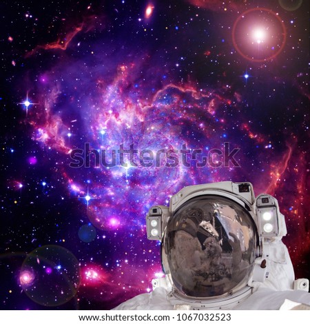 Astronaut and nebula and stars. Science theme. The elements of this image furnished by NASA.