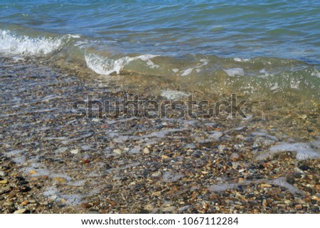 Sea surf on a stony shore.