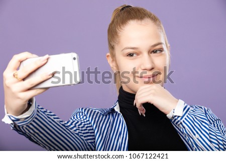 teenager is playing with a mobile phone