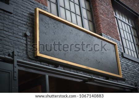 Blank signboard on an old factory building or old warehouse