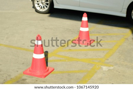Orange cones are placed for alignment that prohibits parking.