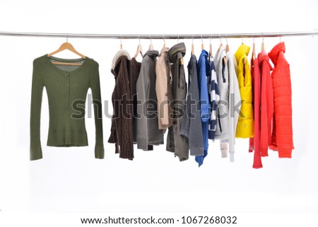 Set of many multi-coloured clothes ,jacket on hanging


