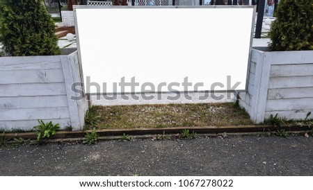 Blank Outdoor Advertisement Billboard Banner Sign on White Wooden Fance.White Display Isolated Template Clipping Path Free Space Ad Mock Up