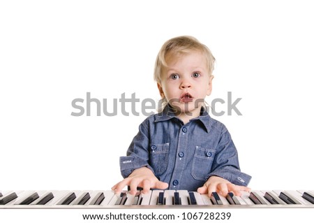 little boy and the keyboard on white background