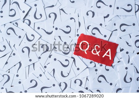 question mark on white paper and Q&A on red paper. questions and answer concept Royalty-Free Stock Photo #1067289020