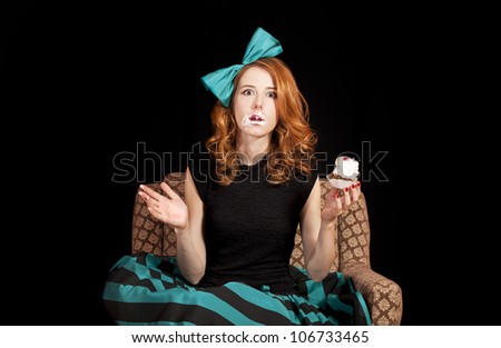 Redhead girl eating cake