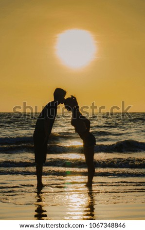 Silhouette couple kissing with love moment.