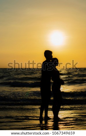 Silhouette couple holding hand in love moment.