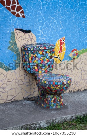 tiled mosaics toilet on the open street in a small town in Costa Rica. Royalty-Free Stock Photo #1067355230