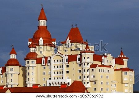 Building  stylized under a fairytale castle with red towers