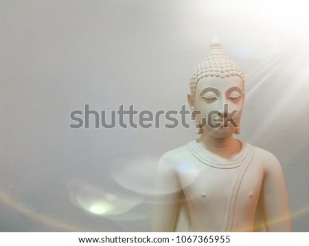 White Buddha with Light and White Background