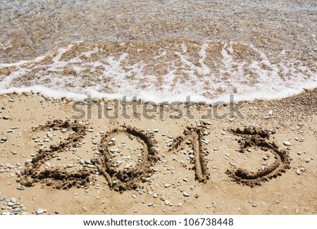 Happy New Year 2013 on the sea beach