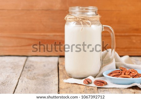 Vegan non dairy pecan  milk  in a jar with copy space