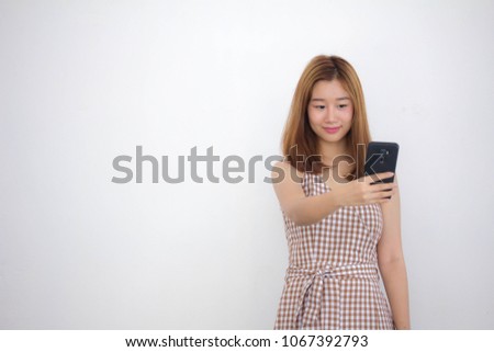 Portrait of thai china adult beautiful girl using her smart phone Selfie