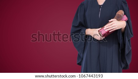 Female judge mid section with book and gavel against maroon background