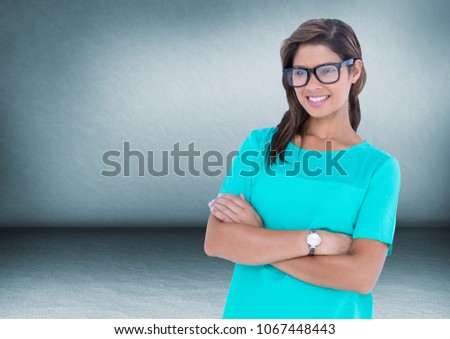 Nerd woman arms folded in blue room
