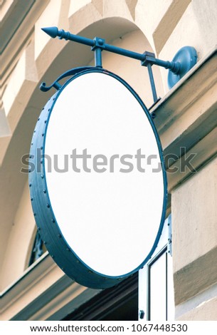 Restaurant signage mockup, blank oval outdoor sign to add text or logo, real life picture 
