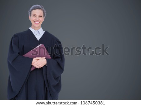 Female judge with book against grey wall