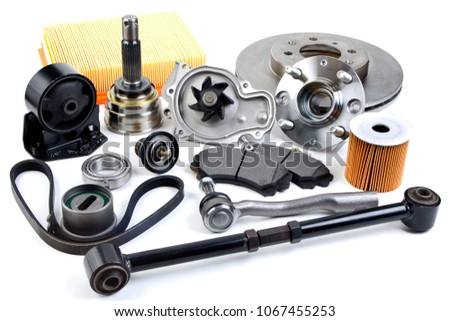 Auto parts background. Hub, pump, brake pads, filter, timing belt, rollers, constant velocity joints, thermostat and other on white background. Set of spare parts for repair