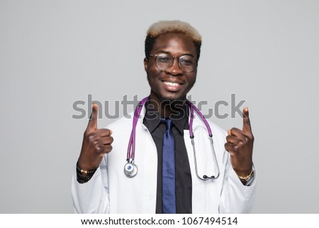 Horizontal closeup of young African American doctor pictured isolated on white background wearing uniform and holding index finger up as if having interesting idea