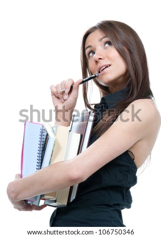 Pretty School girl thinking, holding stack of books, notebook, copy-book and a pen near the head ready for college classes on a white background