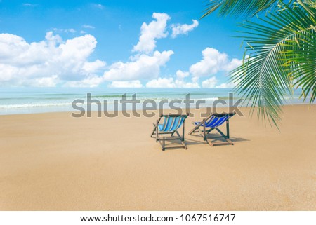 Caribbean Beach.Paradise. Vacation and Tourism concept. Sunbeds and Palm tree