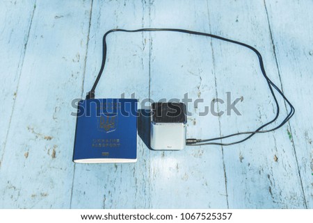 Travel and trip concept with passport documents and music loud speaker on blue background empty space for copy or text