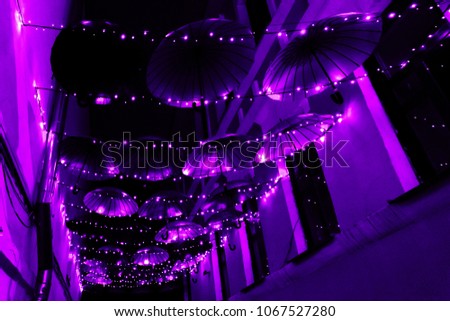 Ultra violet background. Abstract blurred background with rows of round, radiant lights.