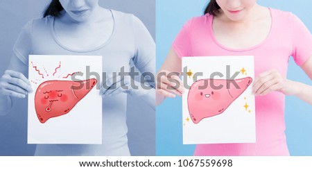 woman take liver billboard with health concept on the blue background