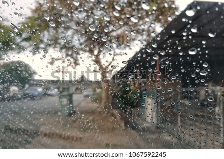 Out Of Focus. Raindrops windshield. Raindrops on the windshield. Blurred image of traffic view through a car windscreen covered in rain.  