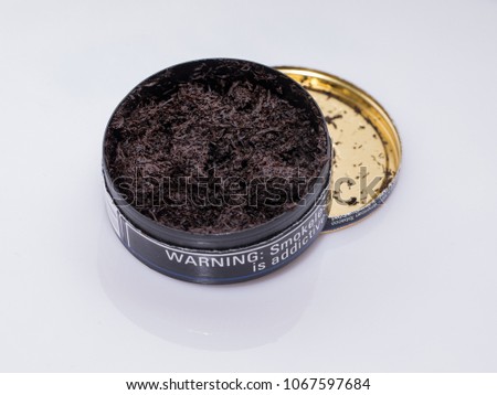 open can of smokeless tobacco is ready for use Royalty-Free Stock Photo #1067597684