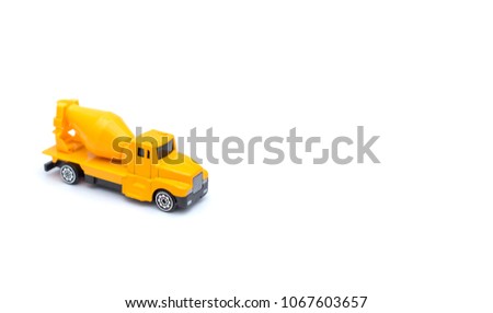Toy cement mixers car on left with white background copy space