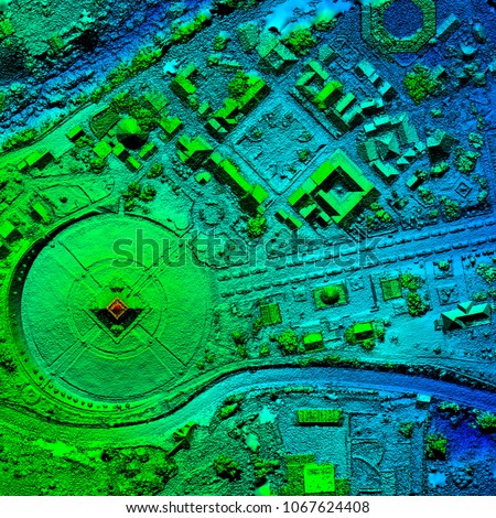 A drone equipped with geospatial technology conducts an aerial survey to create a detailed 3D model of the terrain for mapping and GIS analysis. Royalty-Free Stock Photo #1067624408
