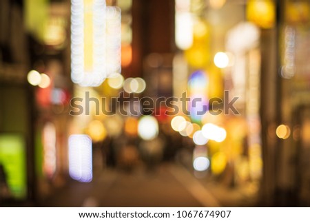 Night blurred bokeh light in Shibuya Tokyo Japan, abstract blur defocused background.cityscape at twilight time