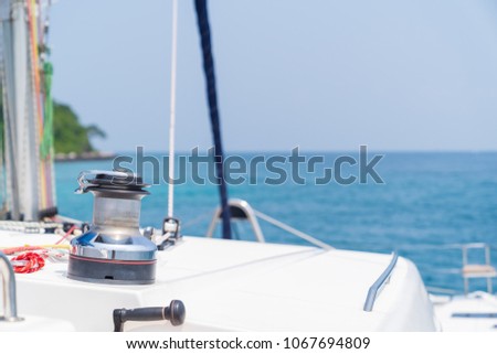 Winch on sailboat while sailing, in yacht on blue sky sunset light background, vacation holidays concept yachts in the sea, luxury summer cruise.