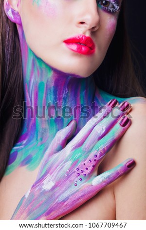fashion model with a big forehead with skin painted in blue, pink and purple colors, fine art photography, unusual make up, close up, neck area