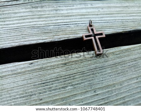 Christian jesus cross on vintage dark wood floor