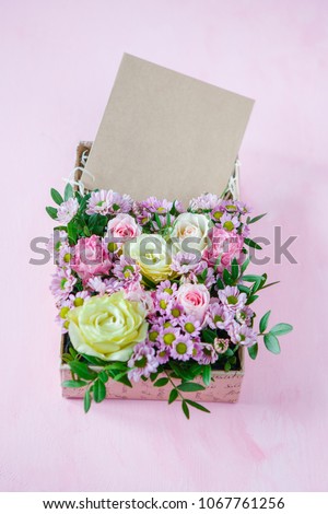 Flower Arrangement in a Design Box with a Business Card
