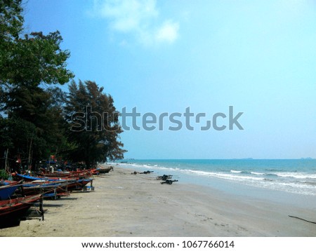 Beautiful tropical beach sea and sunny day with blue sky in Thailand