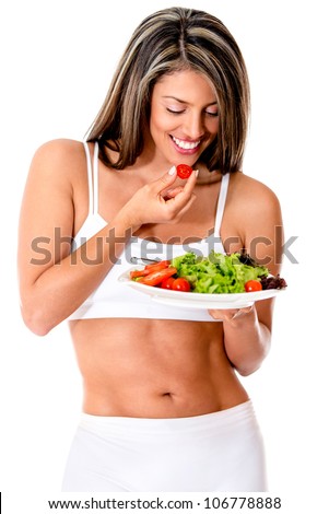 Woman dieting eating a vegetables salad - isolated over white
