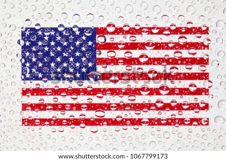 American flag behind a glass covered with rain drops. Patriots day, memorial weekend, veterans day, presidents day, independence day background.
