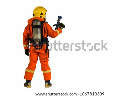 
Studio portrait of firefighter dressed in uniform and safety helmet isolated on white background
