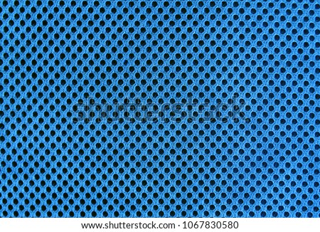 blue breathable porous poriferous material for air ventilation with black holes. jersey mesh